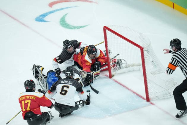 (260308) -- MILAN, March 8, 2026 -- Players of China and Germany compete during the Para Ice hockey, Eishockey preliminary round Group A match between China and Germany at the Milan-Cortina 2026 Paralympic Winter games, Winterspiele,Spiele, Summer games in Milan, Italy, March 7, 2026. ) (SP)ITALY-MILAN-PARALYMPIC WINTER GAMES-PARA ICE HOCKEY-CHINA VS GERMANY LixJing 