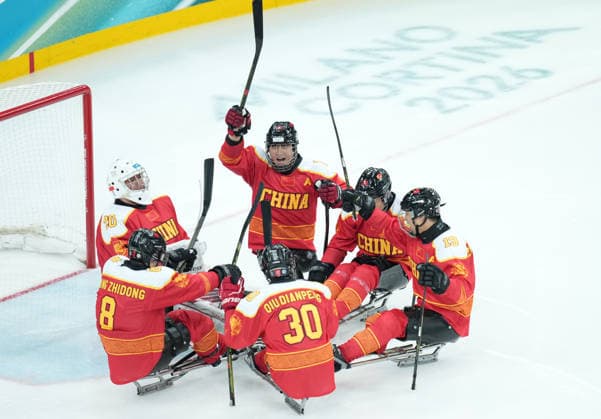 (260308) -- MILAN, March 8, 2026 -- Players of China cheer up during the Para Ice hockey, Eishockey preliminary round Group A match between China and Germany at the Milan-Cortina 2026 Paralympic Winter games, Winterspiele,Spiele, Summer games in Milan, Italy, March 7, 2026. ) (SP)ITALY-MILAN-PARALYMPIC WINTER GAMES-PARA ICE HOCKEY-CHINA VS GERMANY LixJing 