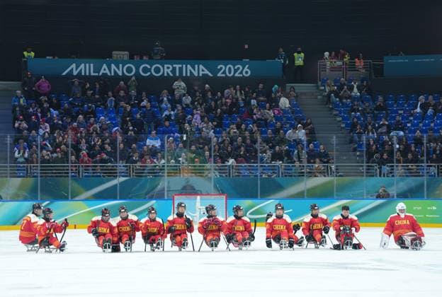 (260308) -- MILAN, March 8, 2026 -- Players of China line up at the end of the Para Ice hockey, Eishockey preliminary round Group A match between China and Germany at the Milan-Cortina 2026 Paralympic Winter games, Winterspiele,Spiele, Summer games in Milan, Italy, March 7, 2026. ) (SP)ITALY-MILAN-PARALYMPIC WINTER GAMES-PARA ICE HOCKEY-CHINA VS GERMANY LixJing 