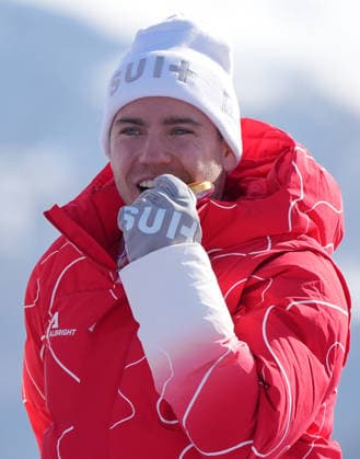 (260308) -- CORTINA D AMPEZZO, March 8, 2026 -- Gold medalist Robin Cuche of Switzerland reacts during the awarding ceremony for the para alpine skiing men s downhill standing match at the Milan-Cortina 2026 Paralympic Winter games, Winterspiele,Spiele, Summer games in Cortina D ampezzo, Italy, March 7, 2026. ) (SP)ITALY-CORTINA D AMPEZZO-PARALYMPIC WINTER GAMES-PARA ALPINE SKIING-MEN S DOWNHILL-STANDING WangxKaiyan 