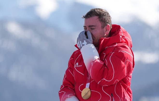 (260308) -- CORTINA D AMPEZZO, March 8, 2026 -- Gold medalist Robin Cuche of Switzerland reacts during the awarding ceremony for the para alpine skiing men s downhill standing match at the Milan-Cortina 2026 Paralympic Winter games, Winterspiele,Spiele, Summer games in Cortina D ampezzo, Italy, March 7, 2026. ) (SP)ITALY-CORTINA D AMPEZZO-PARALYMPIC WINTER GAMES-PARA ALPINE SKIING-MEN S DOWNHILL-STANDING WangxKaiyan 