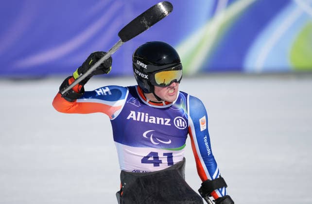 (260308) -- CORTINA D AMPEZZO, March 8, 2026 -- Niels de Langen of the Netherlands reacts during the para alpine skiing men s downhill sitting match at the Milan-Cortina 2026 Paralympic Winter games, Winterspiele,Spiele, Summer games in Cortina D ampezzo, Italy, March 7, 2026. ) (SP)ITALY-CORTINA D AMPEZZO-PARALYMPIC WINTER GAMES-PARA ALPINE SKIING-MEN S DOWNHILL-SITTING WangxKaiyan 
