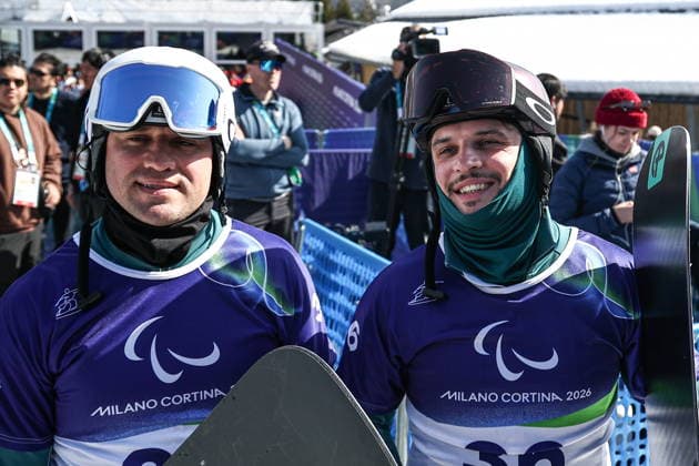ITALY, VENETO - MARCH 8, 2026: Dmitry Fadeyev (L) and Filipp Shebbo of Russia competes during the men s para snowboard snowboard cross SB-LL1 event during the 2026 Winter Paralympic Games on the Olympia delle Tofane of the Tofane Alpine Skiing Centre in Cortina d Ampezzo, Province of Belluno 2026 Winter Paralympics: Para Snowboard  - ZUMAt113 20260308_zaa_t113_085 Copyright: xMikhailxTereshchenkox