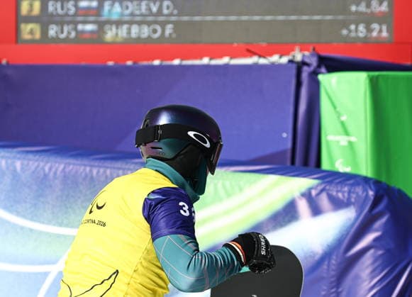 ITALY, VENETO - MARCH 8, 2026: Filipp Shebbo of Russia during the men s para snowboard snowboard cross SB-LL1 event at Cortina Para Snowboard Park during the 2026 Winter Paralympic Games. Mikhail Tereshchenko TASS  89753855