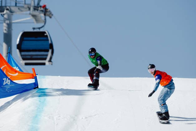 PARALYMPICS - Winter Paralympics Milano Cortina 2026 CORTINA D AMPEZZO,ITALY,08.MAR.26 - PARALYMPICS, SNOWBOARD - Paralympic Winter games, Winterspiele,Spiele, Summer games Milano Cortina 2026, Snowboard Cross. Image shows Oliver Dreier (AUT) and Niklas Lohne-Hansen (NOR).  GEPAxpictures xMaticxKlansek