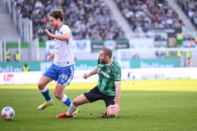 08.03.2026, Fussball, 2. Bundesliga, 25. Spieltag Saison 2025 2026, Preußen Münster - Hertha BSC, Linus Gechter (Hertha BSC), Rico Preißinger (Preußen Münster) xRHR-FOTO TKx