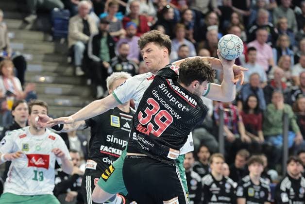 08.03.2026 - Handball - 1. Bundesliga DAIKIN HBL - Saison 2025 2026 - 24. Spieltag: HC Erlangen Metropolregion Nürnberg HCE - GWD Minden - DaMa - xdaxmax - Philipp Vorlicek (22, GWD Minden ) Tobias Buck (39, HC Erlangen HCE )