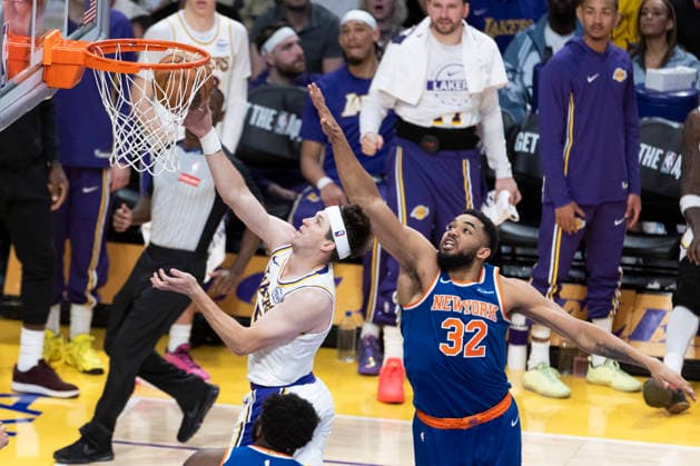 March 8, 2026, Los Angeles, California, USA: Los Angeles LakersÃ¢â‚¬â ¢ Austin Reaves (15) goes past to the basket New York KnicksÃ¢â‚¬â ¢ Karl-Anthony Towns (32) during an NBA, Basketball Herren, USA basketball game at Crypto.com Arena on Sunday, March 8, 2026 in Los Angeles. NBA 2026: Knicks Vs Lakers  - ZUMAc68_ 20260308_zaf_c68_033 Copyright: xRingoxChiux