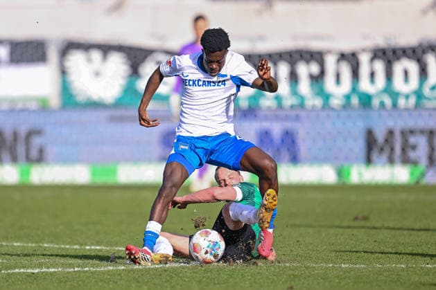 08.03.2026, Fussball, 2. Bundesliga, 25. Spieltag Saison 2025 2026, Preußen Münster - Hertha BSC, Boris Mamuzah Lum (Hertha BSC), Jorrit Hendrix (Preußen Münster) xRHR-FOTO TKx