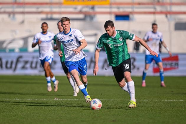 08.03.2026, Fussball, 2. Bundesliga, 25. Spieltag Saison 2025 2026, Preußen Münster - Hertha BSC, Luca Schuler (Hertha BSC), Torge Paetow (Preußen Münster) xRHR-FOTO TKx