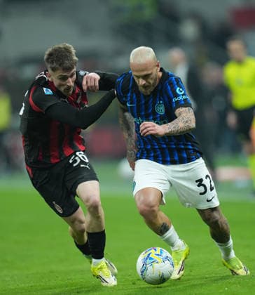 (260309) -- MILAN, March 9, 2026 -- AC Milan s Alexis Saelemaekers(L) vies with Inter Milan s Federico Dimarco during an Italian Serie A football match between AC Milan and Inter Milan in Milan, Italy, March 8, 2026. ) (SP)ITALY-MILAN-FOOTBALL-SERIE A-AC MILAN VS INTER MILAN LixJing 