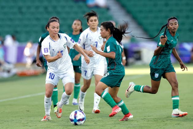 SOCCER ASIAN CUP BANGLADESH UZBEKISTAN, Diyorakhon Khabibullaeva of Uzbekistan is tackled by Maria Manda of Bangladesh during the AFC Women™s Asian Cup Group B match between Bangladesh and Uzbekistan at HBF Park in Perth, Monday, March 9, 2026.( NO ARCHIVING, EDITORIAL USE ONLY PERTH WESTERN AUSTRALIA AUSTRALIA  Copyright: xRICHARDxWAINWRIGHTx 20260309191050078470