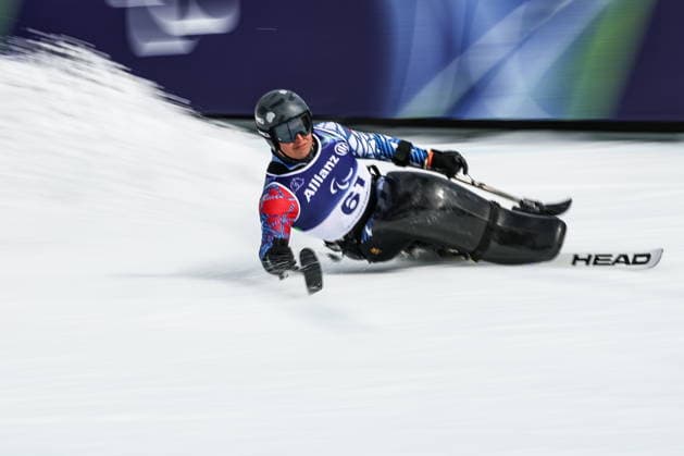 ITALY, VENETO - MARCH 9, 2026: Nicolas Bisquertt Hudson of Chile competes in the men s para alpine skiing super G sitting event at Tofane Alpine Skiing Centre during the 2026 Winter Paralympic Games, in Cortina d Ampezzo, Province of Belluno. Mikhail Tereshchenko TASS  89811149
