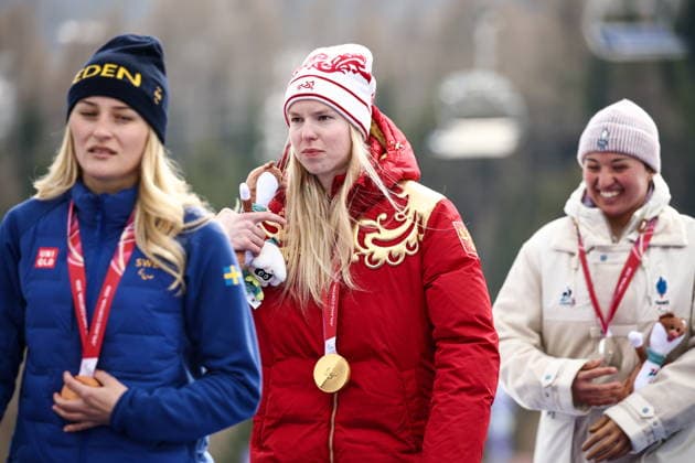 ITALY, VENETO - MARCH 9, 2026: Bronze medallist Ebba Aarsjoe of Sweden, gold medal winner Varvara Voronchikhina of Russia and silver medallist Aurelie Richard of France (L-R) during the victory ceremony for the women s para alpine skiing super G standing event at Tofane Alpine Skiing Centre during the 2026 Winter Paralympic Games, in Cortina d Ampezzo, Province of Belluno 2026 Winter Paralympics: Para Alpine Skiing  - ZUMAt113 20260309_zaa_t113_178 Copyright: xMikhailxTereshchenkox