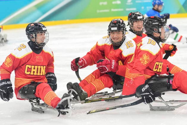 (260309) -- MILAN, March 9, 2026 -- Players of China celebrate a score during the Para Ice hockey, Eishockey preliminary round Group A match between China and Italy at the Milan-Cortina 2026 Paralympic Winter games, Winterspiele,Spiele, Summer games in Milan, Italy, March 9, 2026. ) (SP)ITALY-MILAN-PARALYMPIC WINTER GAMES-PARA ICE HOCKEY-CHINA VS ITALY HouxJun 