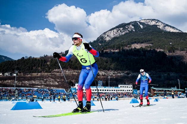 ITALY, TESERO - MARCH 10, 2026: Guide Sergei Siniakin and Anastasia Bagiian of Russia compete in a women s para cross-country skiing classic vision impaired sprint semifinal at Tesero Cross-Country Stadium during the 2026 Winter Paralympic Games 2026 Winter Paralympics: Para Cross-Country Skiing  - ZUMAt113 20260310_zaa_t113_122 Copyright: xMikhailxTereshchenkox