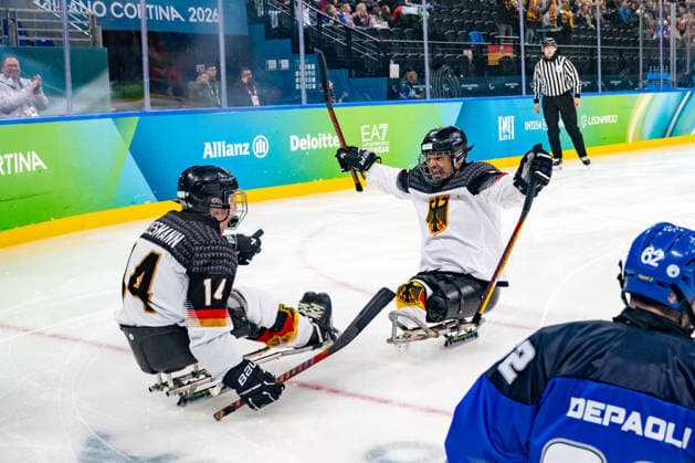 Para Ice hockey, Eishockey - Millano Cortina 2026 Winter Paralympics: Day 4 Para Ice Hockey - Milano Cortina 2026 Winter Paralympics: Day 4 MILANO SANTAGIULIA ICE HOCKEY ARENA BUSSMANN Jano (No. 14, Athlet, Forward, 09.03.2007, Club Wiehl Penguins) scores the first goal for team Germany. WEDDE Joerg (No. 77, Athlet, Forward, 18.08.1965, Club Hannover Ice Lions) is happy about the success of his young teammate. MILANO, ITALY - MARCH 10: Preliminary Round - Group A Italy - Germany Impressions of Team Para Ice Hockey Germany playing Team ITA at March 10 at the Milano Cortina 2026 Winter Paralympics Para Ice Hockey Tournament in the Milano Santagiulia Ice Hockey Arena at day 4. (Photo by RALF KUCKUCK) Copyright 2026 Ralf Kuckuck