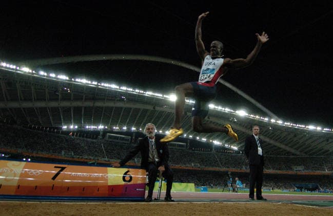 8-26 Karl Mondon Contra Costa Times Men s Track..The United States took the gold and silver in the men s long jump with Dwight Phillips 1st and John Moffitt. This is Dwight Phillips gold medal jump in Olympic Stadium. Copyright: xKarlxMondonx