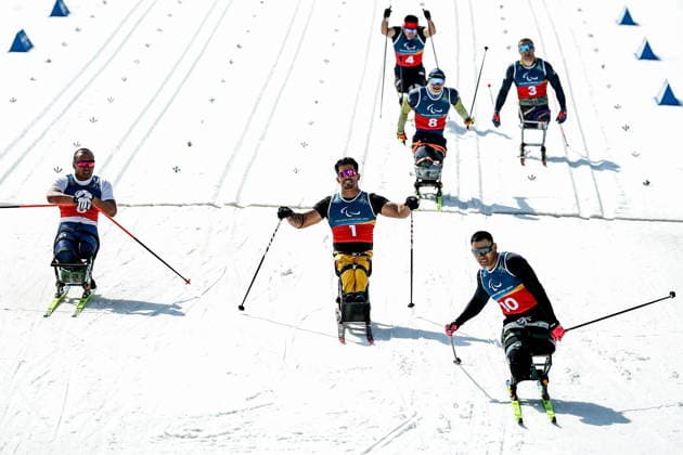 ITALY, TESERO - MARCH 10, 2026: Zixu Liu of China, Cristian Westemaier Ribera of Brazil, and Yerbol Khamitov (L-R) of Kazakhstan finish a men s para cross-country skiing sitting sprint final at Tesero Cross-Country Stadium during the 2026 Winter Paralympic Games 2026 Winter Paralympics: Para Cross-Country Skiing  - ZUMAt113 20260310_zaa_t113_147 Copyright: xMikhailxTereshchenkox