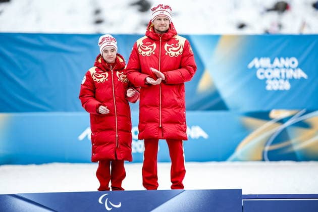 ITALY, TESERO - MARCH 10, 2026: Gold medalists Anastasia Bagiian (L) of Russia and her guide Sergei Siniakin attend the victory ceremony for the women s para cross-country skiing classic vision impaired sprint event at Tesero Cross-Country Stadium during the 2026 Winter Paralympic Games 2026 Winter Paralympics: Para Cross-Country Skiing  - ZUMAt113 20260310_zaa_t113_250 Copyright: xMikhailxTereshchenkox