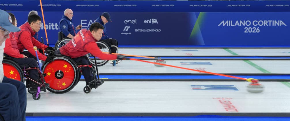 (260310) -- CORTINA D AMPEZZO, March 10, 2026 -- Zhang Mingliang (2nd R) of China competes during the wheelchair curling mixed team round robin session 7 match between China and Canada at the Milan-Cortina 2026 Paralympic Winter games, Winterspiele,Spiele, Summer games in Cortina D ampezzo, Italy, March 10, 2026. ) (SP)ITALY-CORTINA D AMPEZZO-PARALYMPIC WINTER GAMES-WHEELCHAIR CURLING-MIXED TEAM-ROUND ROBIN-CHN VS CAN CaixYang 