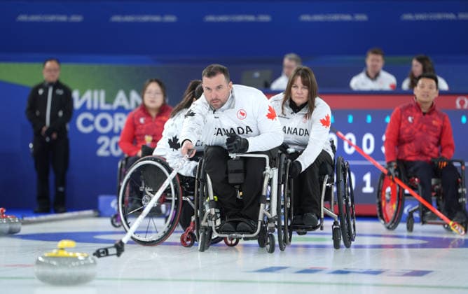 (260310) -- CORTINA D AMPEZZO, March 10, 2026 -- Jon Thurston (C) of Canada competes during the wheelchair curling mixed team round robin session 7 match between China and Canada at the Milan-Cortina 2026 Paralympic Winter games, Winterspiele,Spiele, Summer games in Cortina D ampezzo, Italy, March 10, 2026. ) (SP)ITALY-CORTINA D AMPEZZO-PARALYMPIC WINTER GAMES-WHEELCHAIR CURLING-MIXED TEAM-ROUND ROBIN-CHN VS CAN CaixYang 
