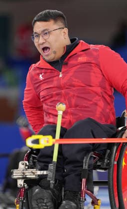 (260310) -- CORTINA D AMPEZZO, March 10, 2026 -- Wang Haitao of China reacts during the wheelchair curling mixed team round robin session 7 match between China and Canada at the Milan-Cortina 2026 Paralympic Winter games, Winterspiele,Spiele, Summer games in Cortina D ampezzo, Italy, March 10, 2026. ) (SP)ITALY-CORTINA D AMPEZZO-PARALYMPIC WINTER GAMES-WHEELCHAIR CURLING-MIXED TEAM-ROUND ROBIN-CHN VS CAN CaixYang 