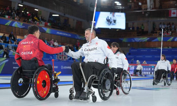 (260310) -- CORTINA D AMPEZZO, March 10, 2026 -- Athletes greet each other after the wheelchair curling mixed team round robin session 7 match between China and Canada at the Milan-Cortina 2026 Paralympic Winter games, Winterspiele,Spiele, Summer games in Cortina D ampezzo, Italy, March 10, 2026. ) (SP)ITALY-CORTINA D AMPEZZO-PARALYMPIC WINTER GAMES-WHEELCHAIR CURLING-MIXED TEAM-ROUND ROBIN-CHN VS CAN CaixYang 