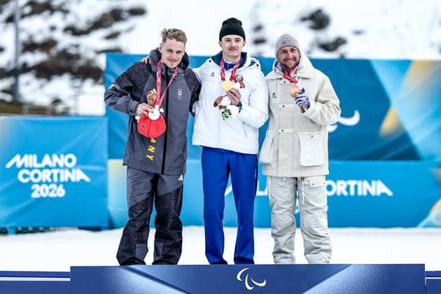 ITALY, TESERO - MARCH 10, 2026: Silver medalist Sebastian Marburger of Germany, gold medalist Raman Svirydzenka of Belarus, and Benjamin Daviet (L-R) of France poses during the victory ceremony for the men s para cross-country skiing classic standing sprint event at Tesero Cross-Country Stadium during the 2026 Winter Paralympic Games 2026 Winter Paralympics: Para Cross-Country Skiing  - ZUMAt113 20260310_zaa_t113_276 Copyright: xMikhailxTereshchenkox