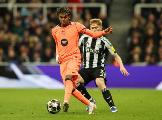 Newcastle Upon Tyne, England, 10th March 2026. Lamine Yamal of FC Barcelona, Barca held up by Lewis Hall of Newcastle United during the Newcastle United vs FC Barcelona UEFA Champions League match at St. James Park, Newcastle Upon Tyne. Picture credit should read: Nigel Roddis Sportimage EDITORIAL USE ONLY. No use with unauthorised audio, video, data, fixture lists, club league logos or live services. Online in-match use limited to 120 images, no video emulation. No use in betting, games or single club league player publications. SPI_032_NR_NEWC_BARCx SPI-4596-0032