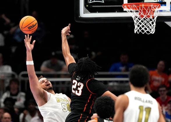 MAR 10 2026: Oklahoma State Cowboys center Benjamin Ahmed (23) blocks Colorado Buffaloes center Elijah Malone (50) shot in the Big 12 Championship Tournament at T-Mobile center, Kansas City, Missouri. CSM. Kansas City United States - ZUMAc04_ 20260310_zma_c04_202 Copyright: xJonxRobichaudx