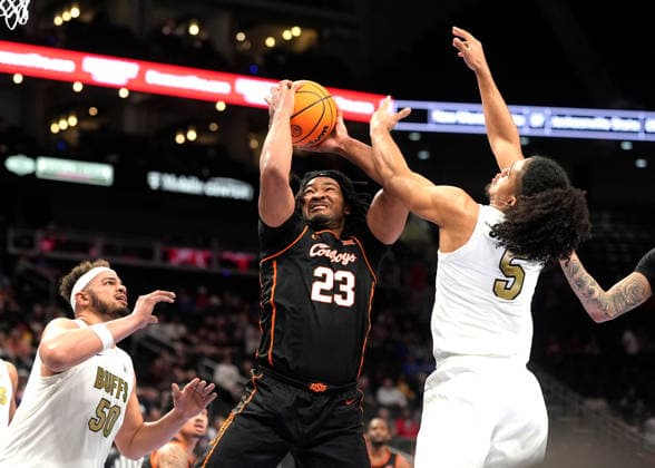 MAR 10 2026: Oklahoma State Cowboys center Benjamin Ahmed (23) fights for the rebound against Colorado Buffaloes guard Josiah Sanders (5) in the Big 12 Championship Tournament at T-Mobile center, Kansas City, Missouri. CSM. Kansas City United States - ZUMAc04_ 20260310_zma_c04_209 Copyright: xJonxRobichaudx