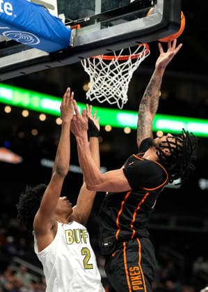 MAR 10 2026: Oklahoma State Cowboys guard Isaiah Coleman (21) scores on Colorado Buffaloes guard Isaiah Johnson (2) plus 1 in the Big 12 Championship Tournament at T-Mobile center, Kansas City, Missouri. CSM. Kansas City United States - ZUMAc04_ 20260310_zma_c04_212 Copyright: xJonxRobichaudx