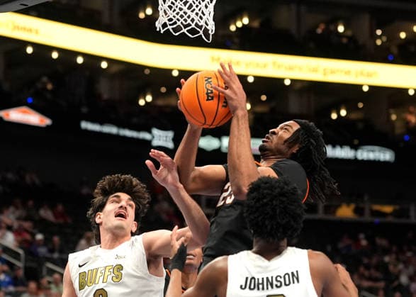 MAR 10 2026: Oklahoma State Cowboys center Benjamin Ahmed (23) fights to get a shot off against Colorado Buffaloes forward Alon Michaeli (3) in the Big 12 Championship Tournament at T-Mobile center, Kansas City, Missouri. CSM. Kansas City United States - ZUMAc04_ 20260310_zma_c04_214 Copyright: xJonxRobichaudx