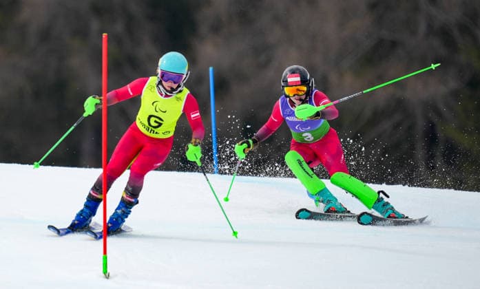 (260311) -- CORTINA D AMPEZZO, March 11, 2026 -- Veronika Aigner (R) of Austria and her guide Lilly Sammer compete during the para alpine skiing women s combined vision impaired event at the Milan-Cortina 2026 Paralympic Winter games, Winterspiele,Spiele, Summer games in Cortina D ampezzo, Italy, March 10, 2026. ) (SP)ITALY-CORTINA D AMPEZZO-PARALYMPIC WINTER GAMES-PARA ALPINE SKIING-WOMEN S COMBINED-VISION IMPAIRED WangxKaiyan 