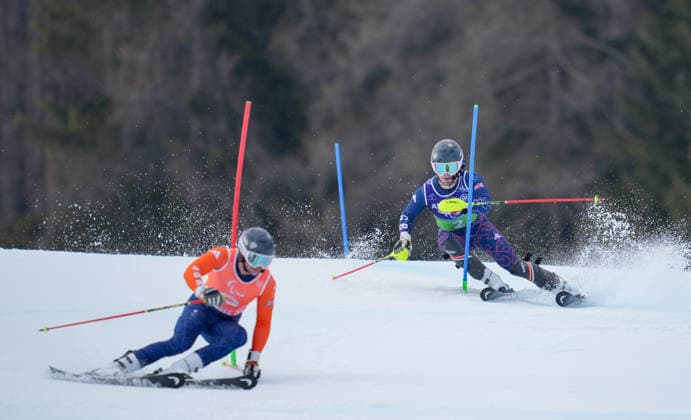 (260311) -- CORTINA D AMPEZZO, March 11, 2026 -- Neil Simpson (R) and his guide Rob Poth of Britain compete during the Para Alpine Skiing Men s Alpine Combined Vision Impaired event at the Milan-Cortina 2026 Paralympic Winter games, Winterspiele,Spiele, Summer games in Cortina D ampezzo, Italy, March 10, 2026. ) (SP)ITALY-CORTINA D AMPEZZO-PARALYMPIC WINTER GAMES-PARA ALPINE SKIING-MEN S ALPINE COMBINED-VISION IMPAIRED WangxKaiyan 