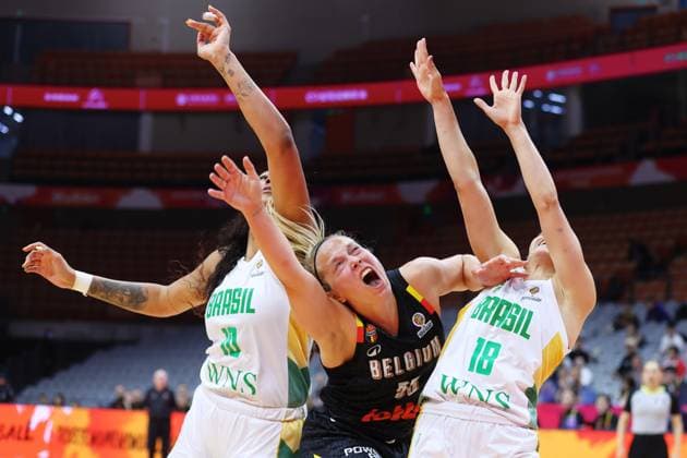 qBelgium s Julie Allemand and Brazil s Aline Moura fight for the ball during a basket game between Brazil and Belgium s national team, Nationalteam Belgian Cats, in Wuhan, China, on Wednesday 11 March 2026, the first day (of 5) of the qualifications phase for the World Cup Basket tournament. NIKOLAxKRSTIC  x167124210x
