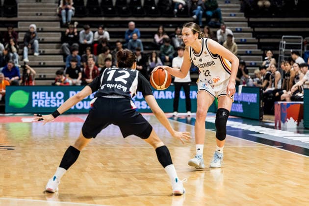 LYON-VILLEURBANNE, FRANCE - MARCH 11: Emily Bessoir (Germany, 22) controls the ball against Haeran Lee (Republic of Korea, 12) during the FIBA Women™s World Cup Qualifying Tournament match between Germany vs. Republic of Korea at Astroballe on matchday 1 of the FIBA Women™s World Cup Qualifying Tournament on March 11, 2026 in Lyon-Villeurbanne, France. France Copyright: xSteffiexWunderlx