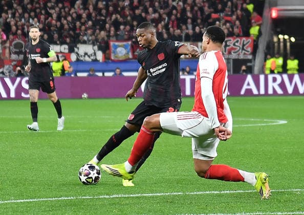 11.03.2026, xhbx, Fussball UEFA Champions League, Bayer 04 Leverkusen - FC Arsenal London v.l. Christian Kofane (Bayer Leverkusen), Gabriel Magalhaes (Arsenal London FC) (DFL DFB REGULATIONS PROHIBIT ANY USE OF PHOTOGRAPHS as IMAGE SEQUENCES and or QUASI-VIDEO) Leverkusen