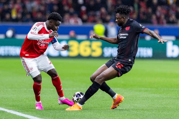 LEVERKUSEN, GERMANY - MARCH 11: Bukayo Saka (FC Arsenal, 7), Edmond Tapsoba (Bayer 04 Leverkusen, 12) during the UEFA Champions League match between Bayer Leverkusen vs. FC Arsenal in the first leg of the round of 16 at BayArena on March 11th, 2026 in Leverkusen, Germany. NRW Germany Copyright: xBEAUTIFULxSPORTS JulianxMeuselx