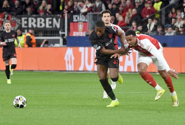 11.03.2026, xhbx, Fussball UEFA Champions League, Bayer 04 Leverkusen - FC Arsenal London v.l. Christian Kofane (Bayer Leverkusen), Gabriel Magalhaes (Arsenal London FC) (DFL DFB REGULATIONS PROHIBIT ANY USE OF PHOTOGRAPHS as IMAGE SEQUENCES and or QUASI-VIDEO) Leverkusen