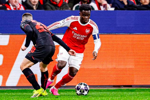 Bukayo Saka of Arsenal FC battles for possession with Alejandro Grimaldo of Bayer 04 Leverkusen Bayer 04 Leverkusen v Arsenal FC, UEFA Champions League 2025 26 Round of 16 First Leg, Bayer 04 Leverkusen v Arsenal FC, BayArena, March 11, 2026, Leverkusen, Germany.
