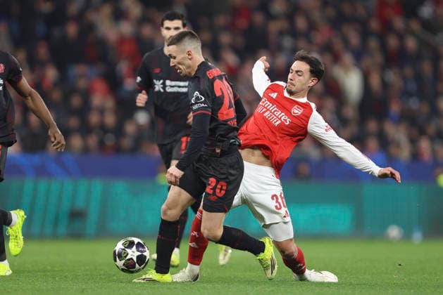 Alejandro Grimaldo (Bayer 04 Leverkusen) und Martin Zubimendi (Arsenal FC) battle for the ball during the UEFA Champions League 2025 26 Round of 16 First Leg match between Bayer 04 Leverkusen and Arsenal FC at BayArena on March 11, 2026 in Leverkusen, Germany. (Photo by Oliver Kaelke DeFodi Images) -