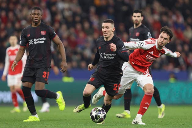 Alejandro Grimaldo (Bayer 04 Leverkusen) und Martin Zubimendi (Arsenal FC) battle for the ball during the UEFA Champions League 2025 26 Round of 16 First Leg match between Bayer 04 Leverkusen and Arsenal FC at BayArena on March 11, 2026 in Leverkusen, Germany. (Photo by Oliver Kaelke DeFodi Images) -