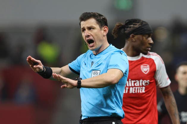 referee Halil Umut Meler gestures during the UEFA Champions League 2025 26 Round of 16 First Leg match between Bayer 04 Leverkusen and Arsenal FC at BayArena on March 11, 2026 in Leverkusen, Germany. (Photo by Oliver Kaelke DeFodi Images) -