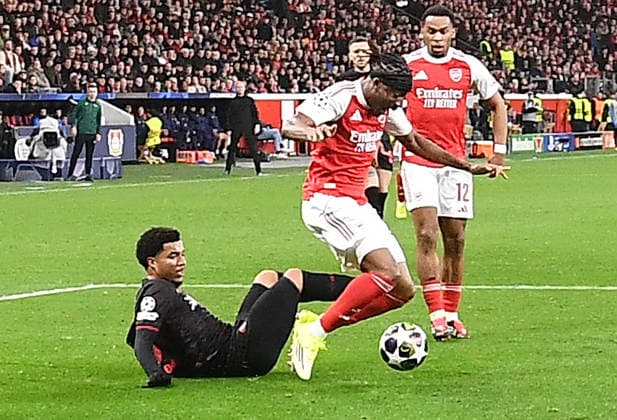 11.03.2026, xhbx, Fussball UEFA Champions League, Bayer 04 Leverkusen - FC Arsenal London v.l. Malik Tillman (Bayer Leverkusen), Noni Madueke (Arsenal London FC), Foul, welches zum Elfmetertor von Kai Havertz (Arsenal London FC) führte (DFL DFB REGULATIONS PROHIBIT ANY USE OF PHOTOGRAPHS as IMAGE SEQUENCES and or QUASI-VIDEO) Leverkusen