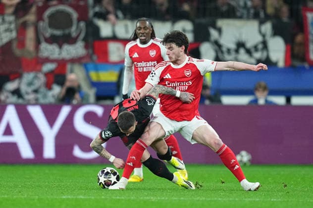 Declan Rice (FC Arsenal) and Aleix Garcia (Bayer 04 Leverkusen) battle for the ball during Bayer Leverkusen and FC Arsenal at BayArena, Leverkusen, Germany on March 11, 2026. Thor Wegner DeFodi Images. (Photo by DeFodi Images) -