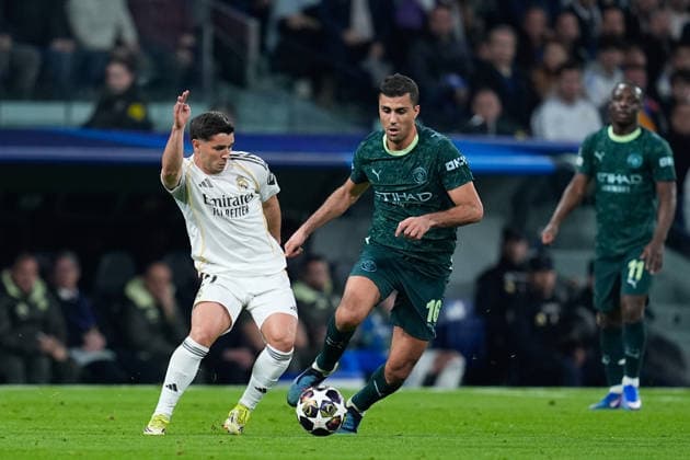 March 11, 2026, Madrid, Madrid, Spain: Brahim Diaz of Real Madrid CF and Rodri of Manchester City compete for the ball during the UEFA Champions League 2025 26 Round of 16 First Leg match between Real Madrid C.F. and Manchester City at Bernabeu stadium on March 11, 2026, in Madrid, Spain. Madrid Spain - ZUMAa181 20260311_zaa_a181_061 Copyright: xDennisxAgyemanx
