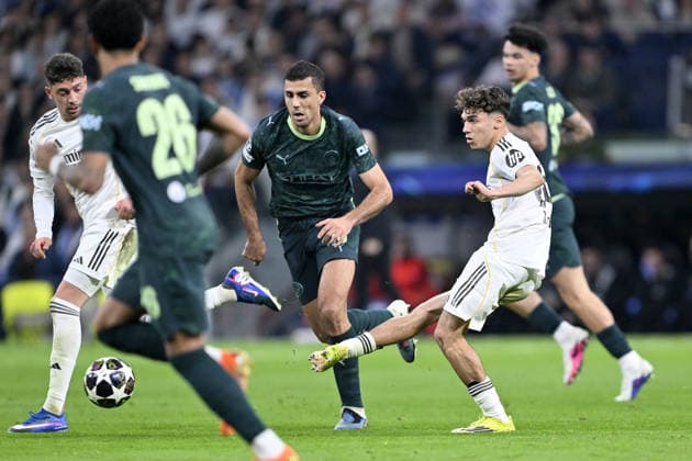 Real Madrid v Manchester City - UEFA Champions League MADRID, SPAIN - MARCH 11: Thiago Pitarch Pinar (R) of Real Madrid in action against Rodri (C) of Manchester City during the UEFA Champions League round of 16 match between Real Madrid and Manchester City at the Bernabeu Stadium in Madrid, Spain, on March 11, 2026. Burak Akbulut Anadolu Madrid Spain. Editorial use only. Please get in touch for any other usage.  Copyright: x2026xAnadoluxBurakxAkbulutx