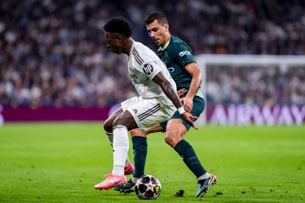 Real Madrid CF v Manchester City FC - UEFA Champions League 2025 26 Round of 16 First Leg Vinicius Junior of Real Madrid (L) is in action with the ball defended by Rodri of Manchester City (R) during the UEFA Champions League 2025 26 Round of 16 First Leg match between Real Madrid CF and Manchester City FC at Estadio Santiago Bernabeu on March 11, 2026 in Madrid, Spain. Madrid Estadio Santiago Bernabeu Madrid Spain Copyright: xAlbertoxGardinx AGardin_20260311_Foot_Champ_Atl_Mad_Man_City__1493